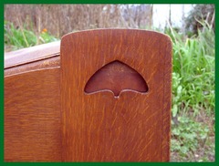 Close-up of one of two cut-out designs at the head of the daybed.